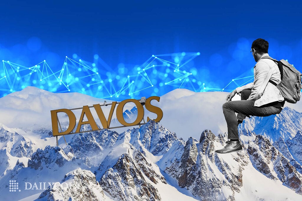 Man on the Swiss Alps, looking at a Davos sign in front of blockchain behind snowy mountains.