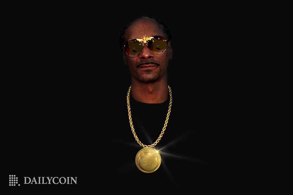 Rapper Snoop Dogg posing with a gold chain embossed with Shiba Inu clothing pendant.