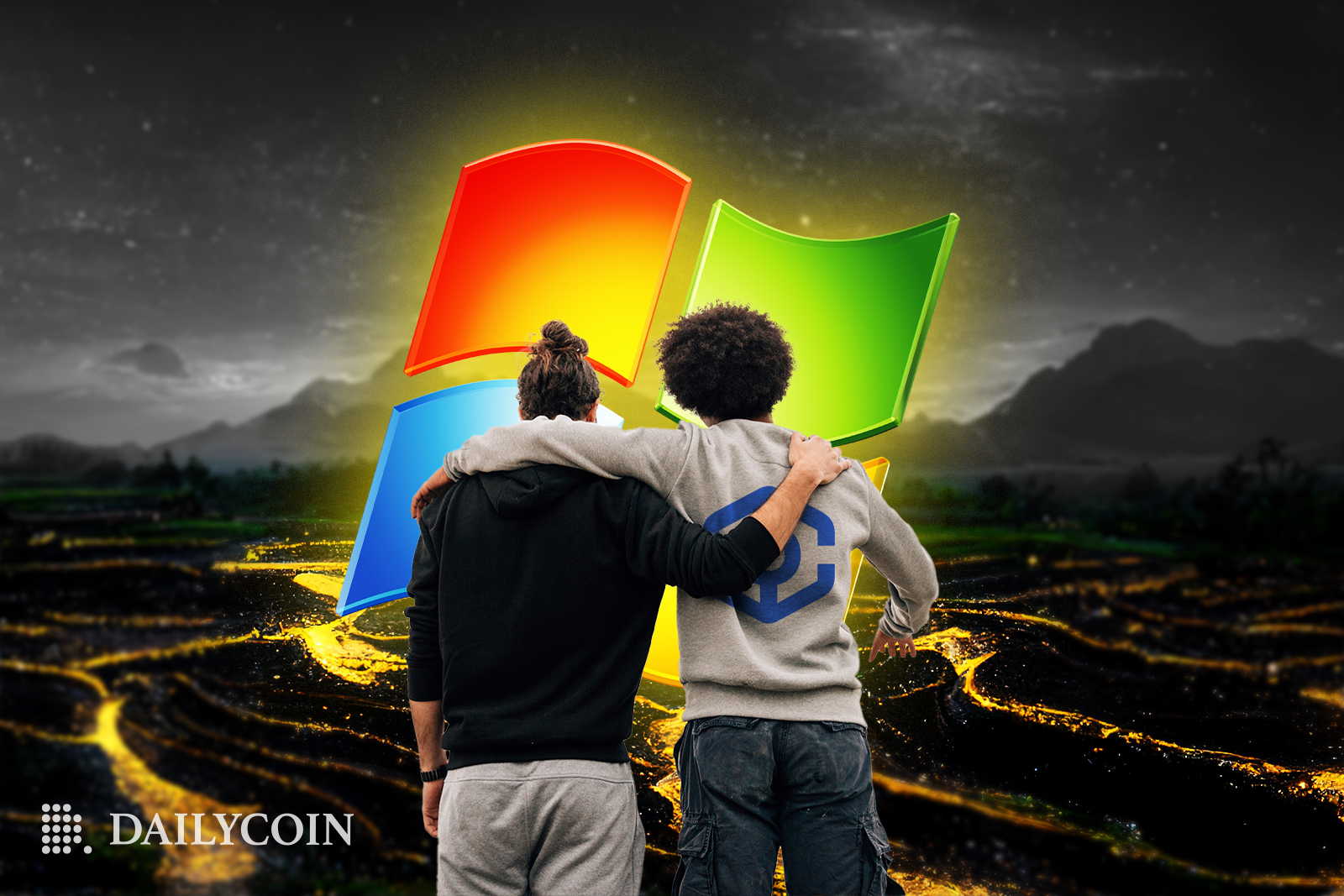 two guys hugging each other while looking at Microsoft logo