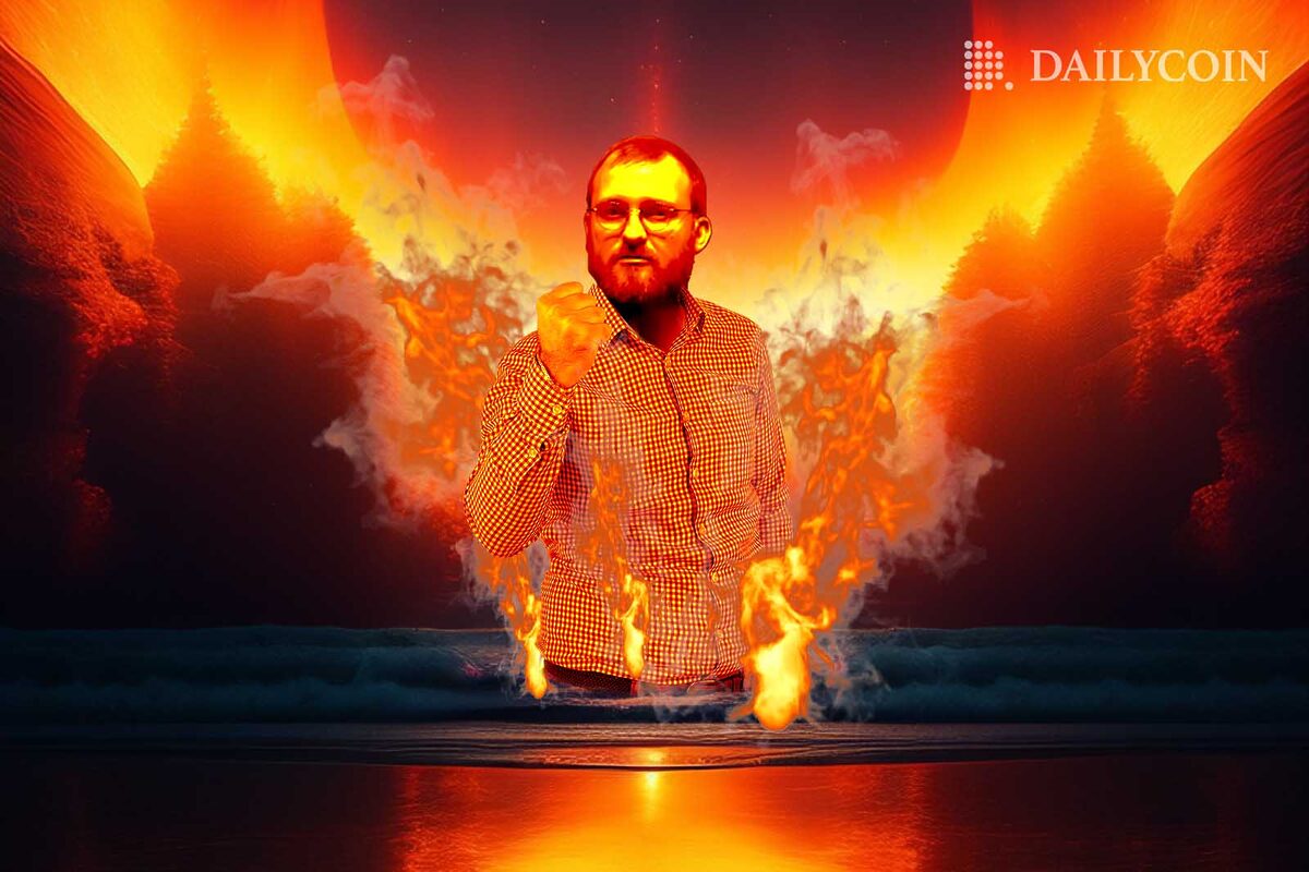 Charles Hoskinson standing in fire over a pool of water