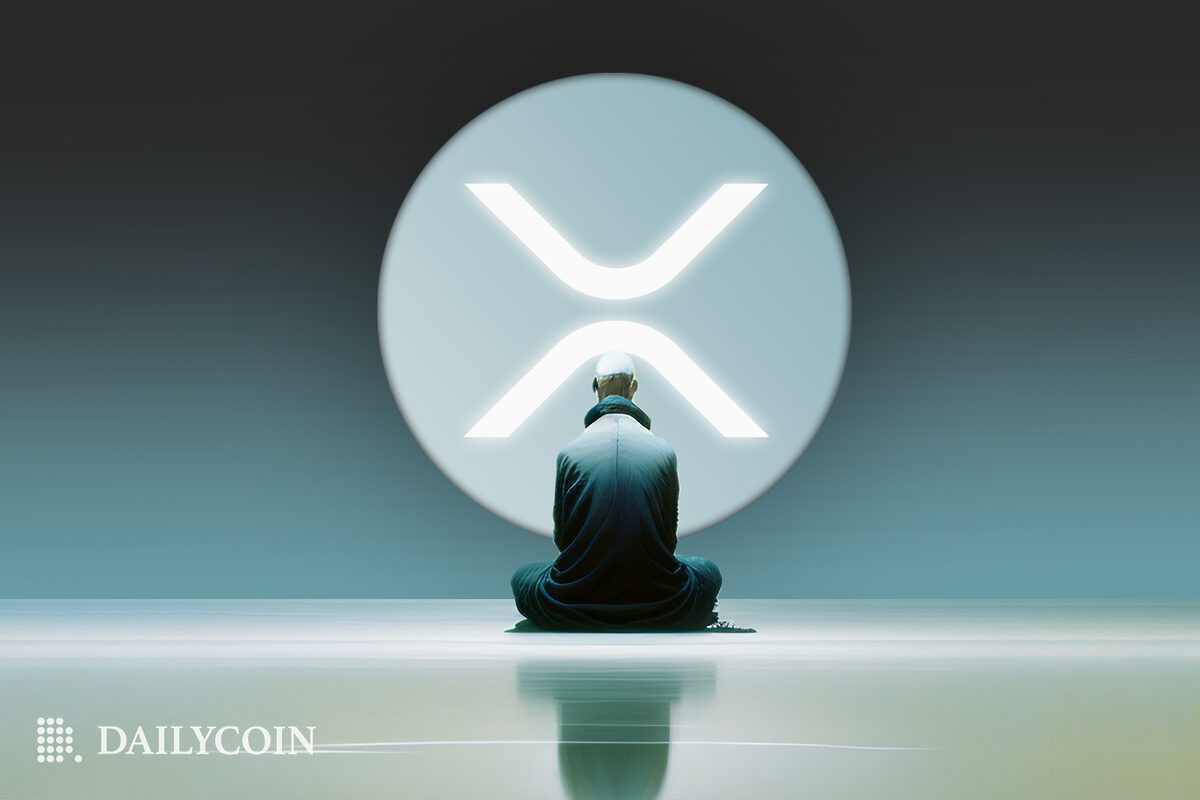 A man sitting in a room staring at the XRP token logo
