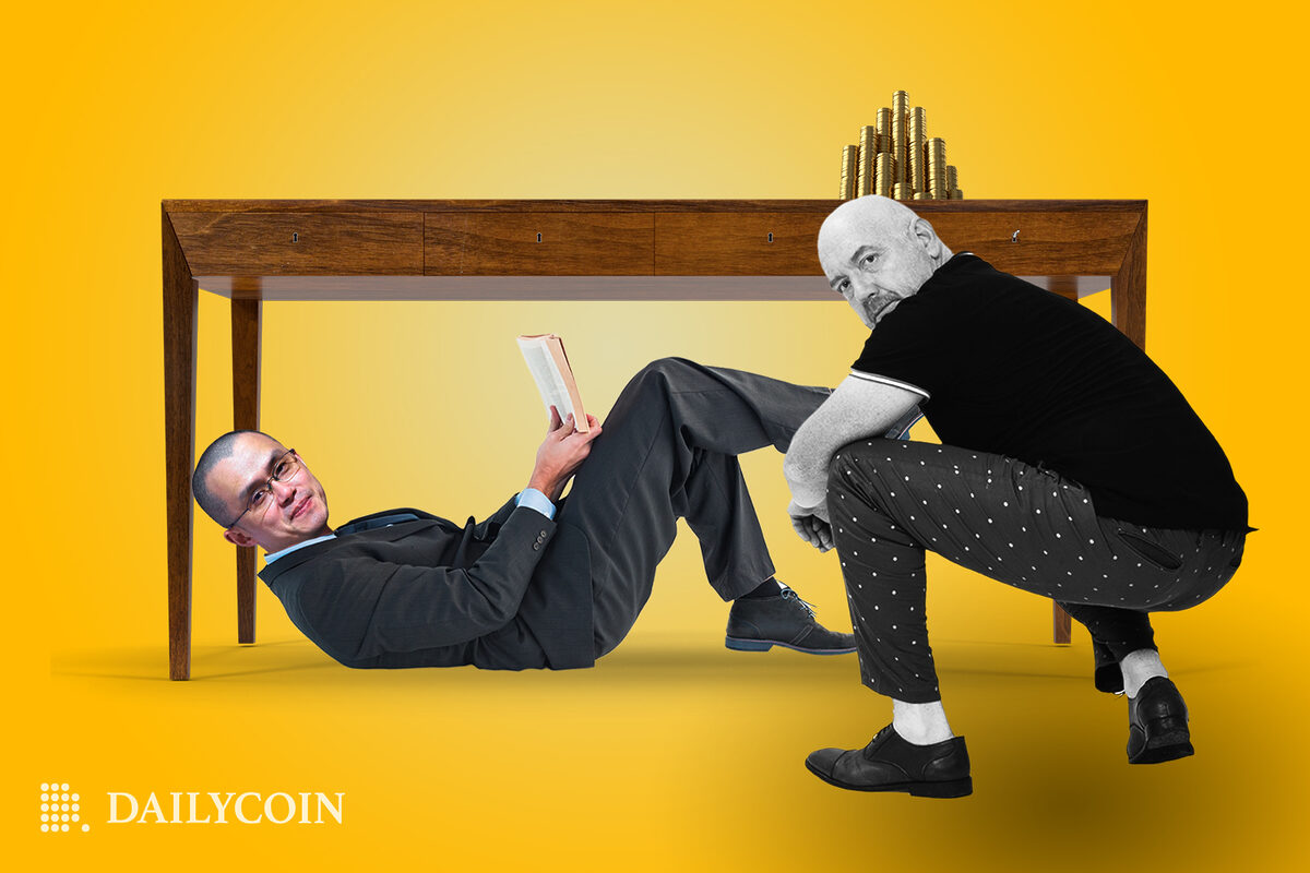 Binance CZ reading under desk, as a CoinDesk CEO is looking for him.