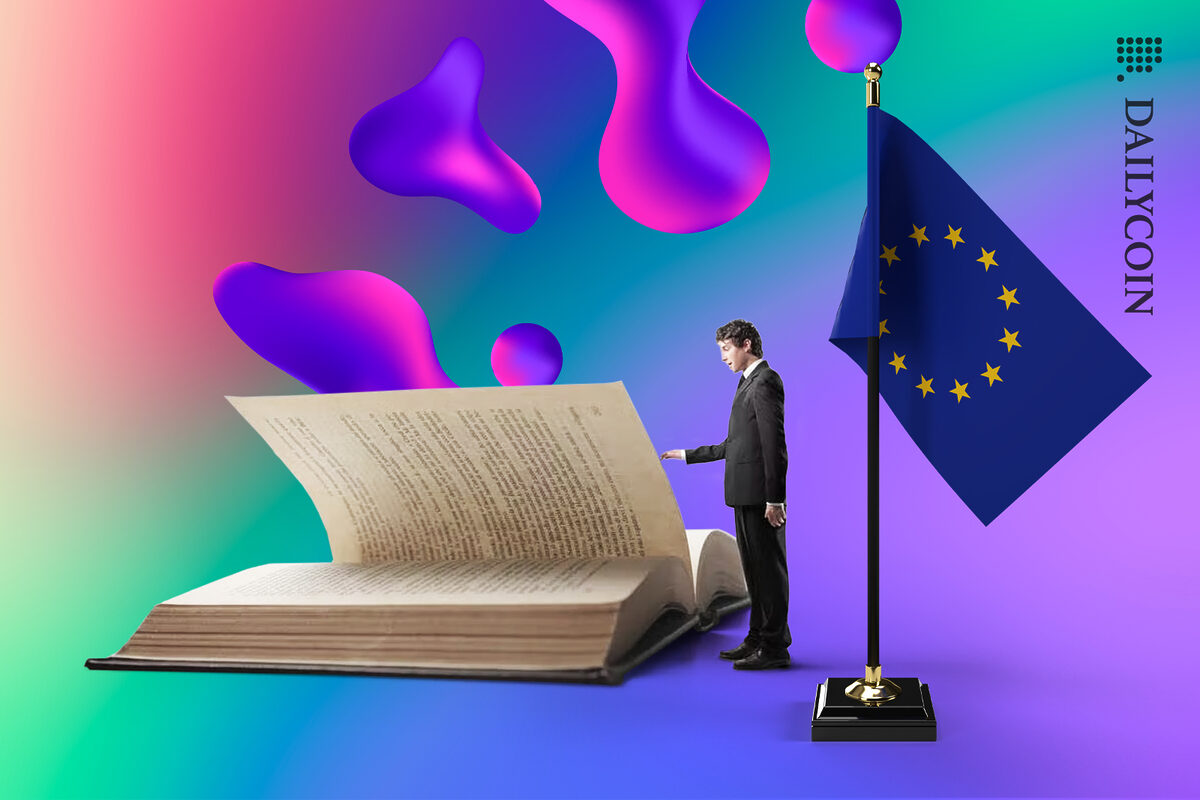 A tiny man reading a giant book next to an EU flag.