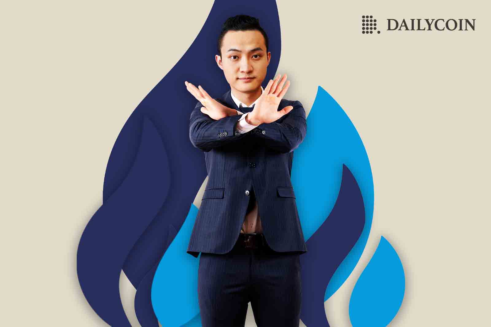 Justin Sun crossing his hands in opposition, symbolizing his denial of pitching Huobi to Binance.