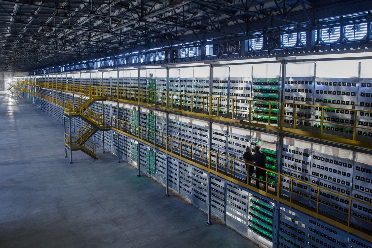 enormous warehouse full of crypto mining hardware