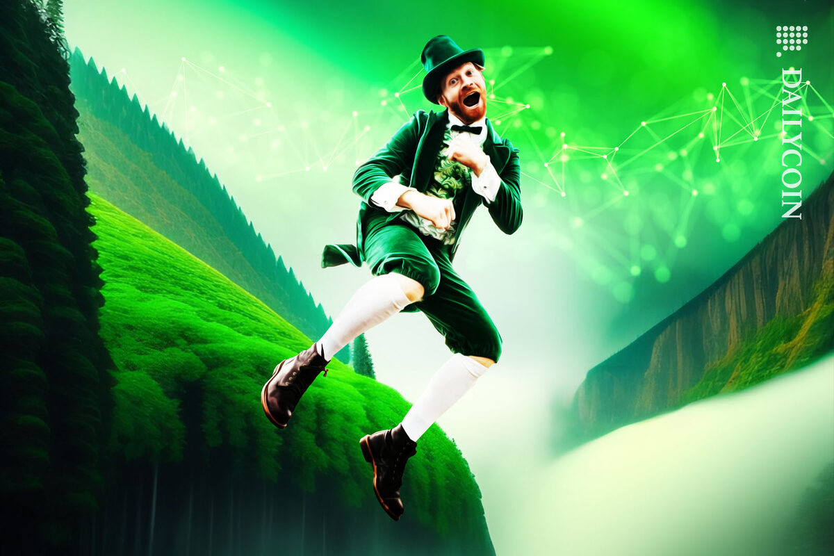 An Irish man dressed in all green, jumping in the air in front of a green valley.