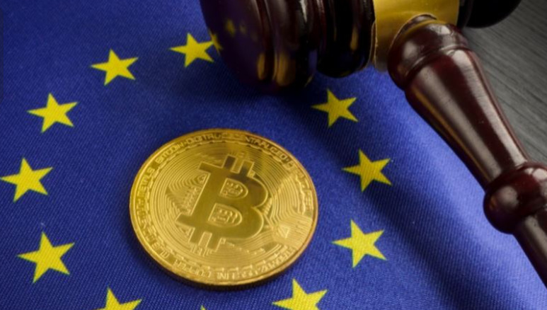 Bitcoin and gavel on top of European Union flag.