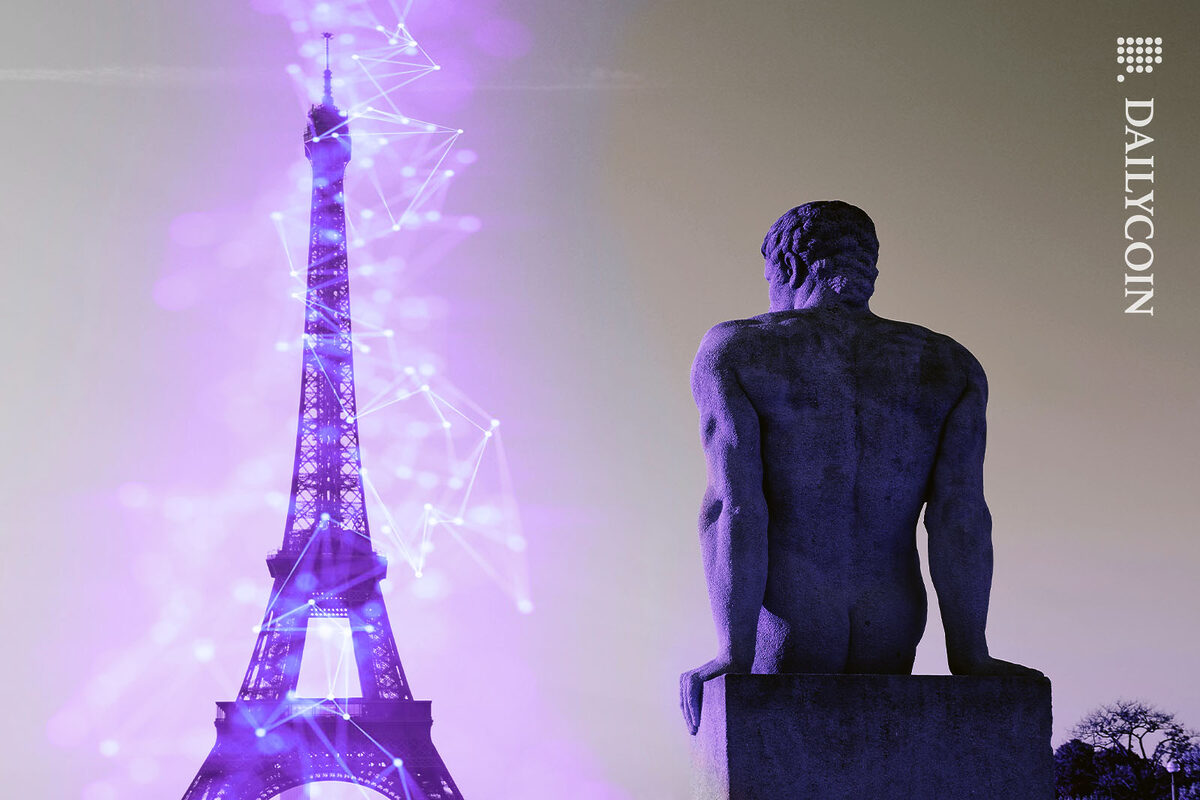 Lights around the Eiffel Tower suggesting the crypto friendly policies of france, over looked by a statue near by.