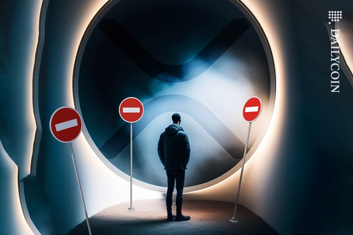 Man standing in front of XRP door next to a scattered road signs of no entry.