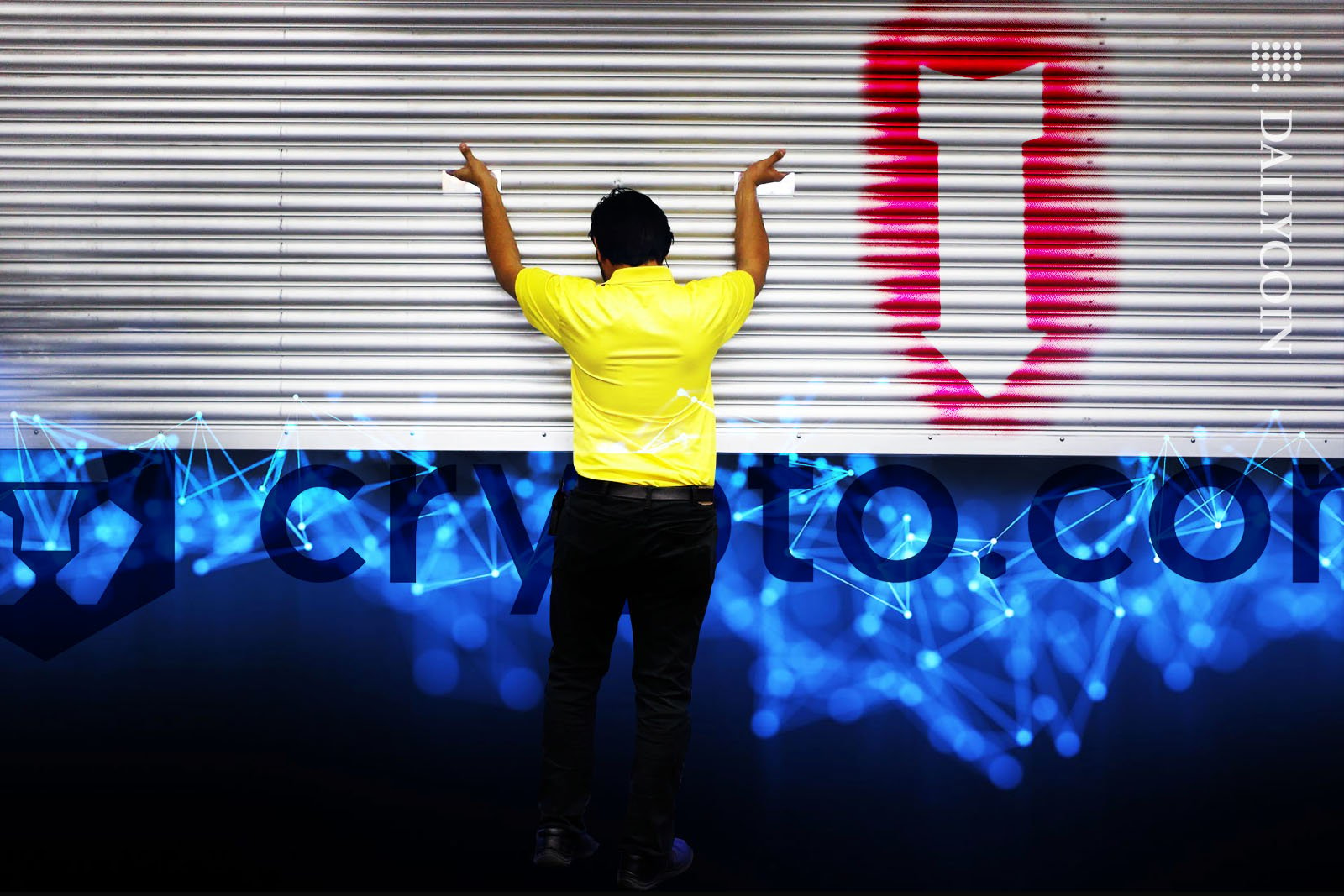 Man in yellow T-shirt closing the shutter over a big crypto.com logo.