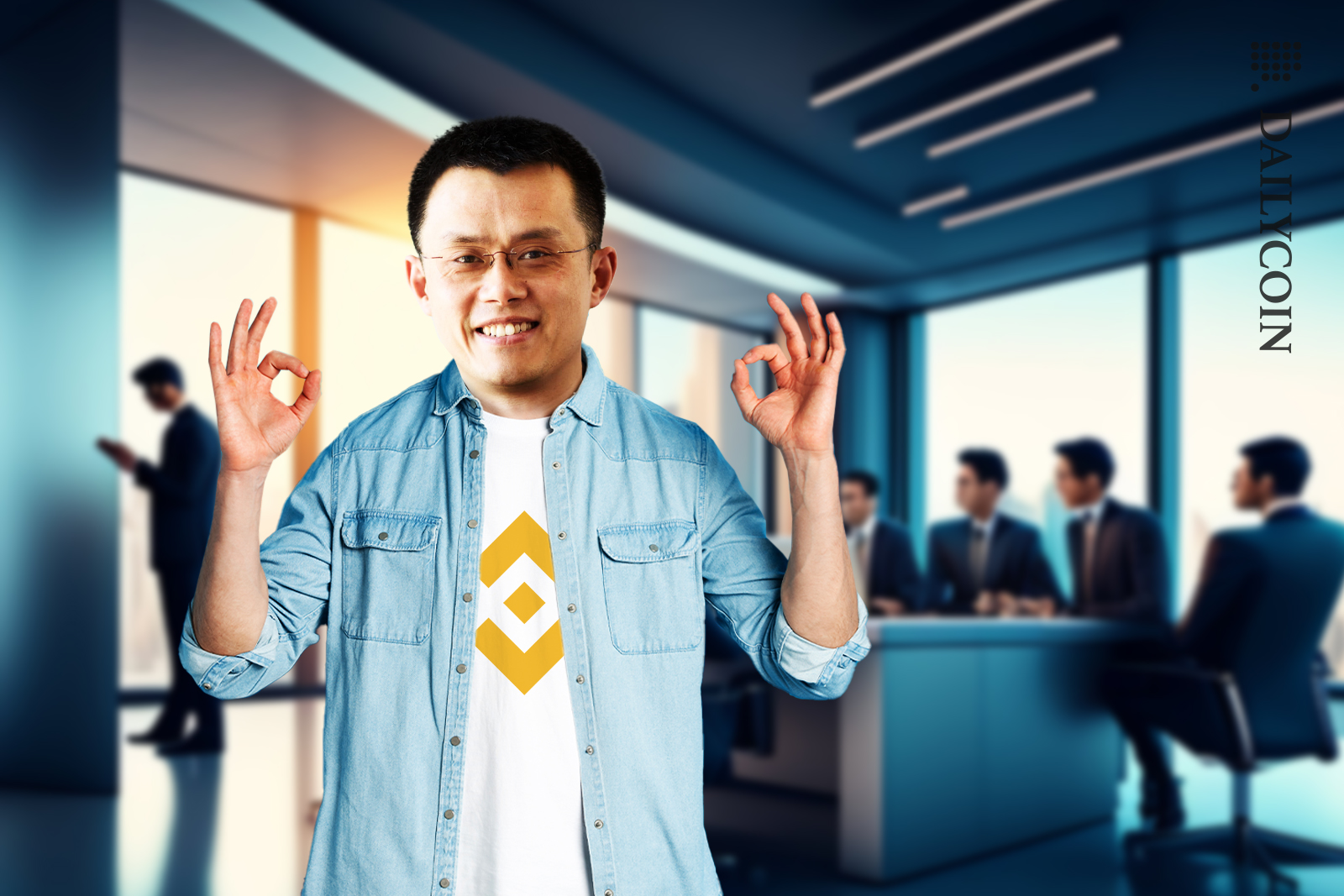 Binance CEO Changpeng Zhao showing ok hands in a working office.