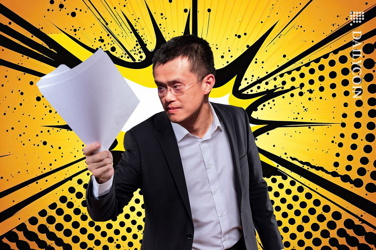 Binance Changpeng Zhao CZ looking angry at documents.