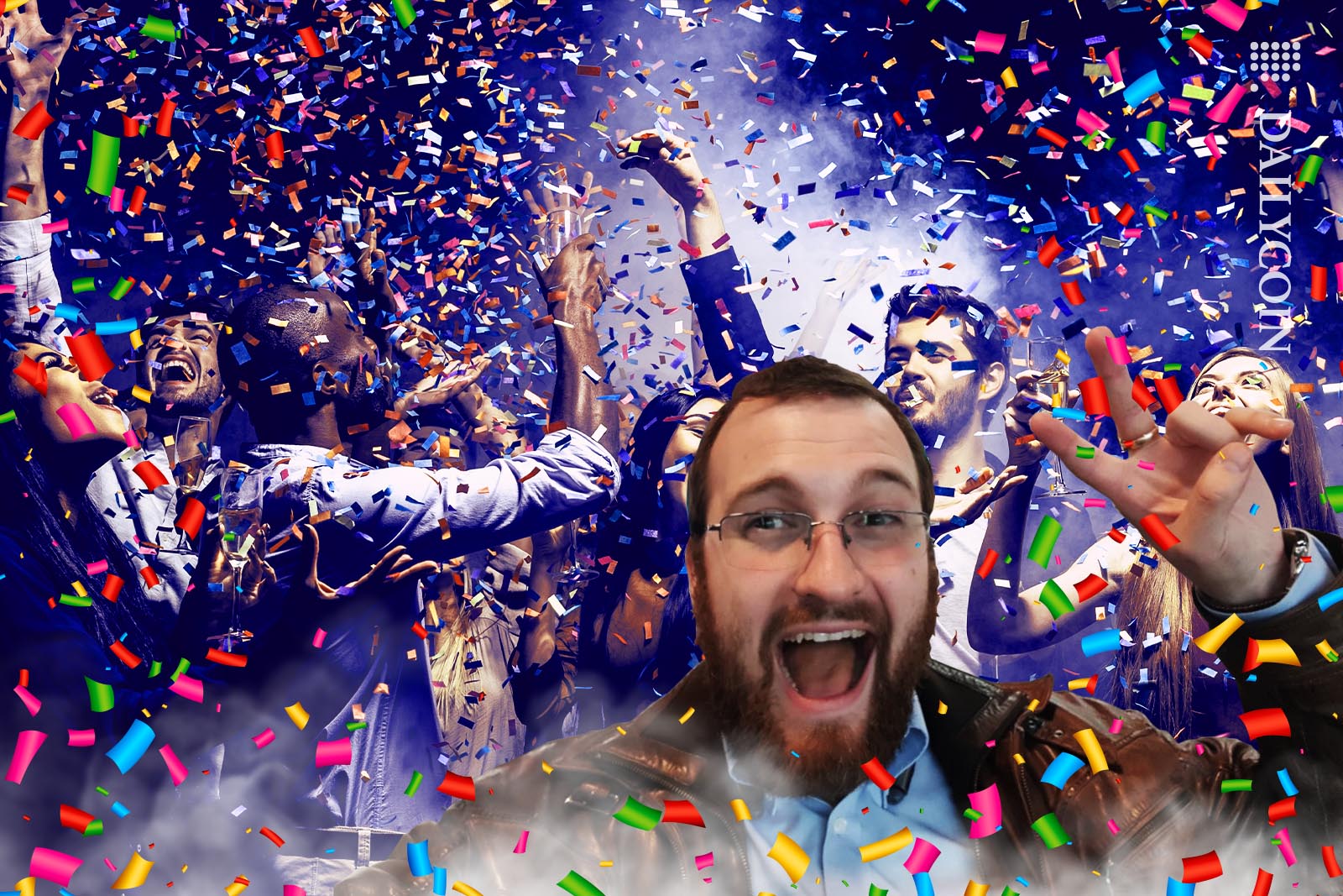 Charles Hoskinson is ecstatic, celebrating with a crowd of people in a downpoor of confetti.