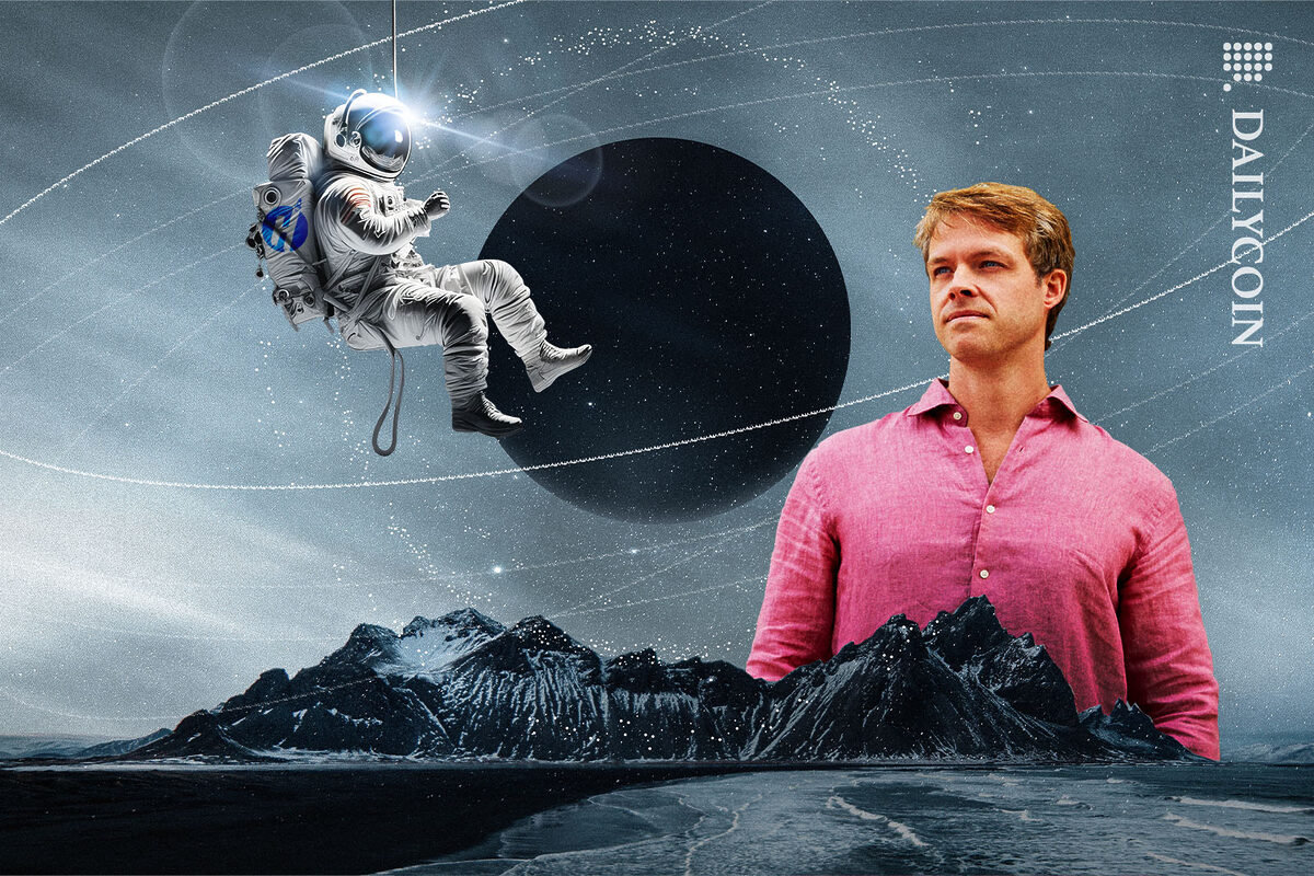 Kyle Davies staring at an astronaut hanging on a string from space.