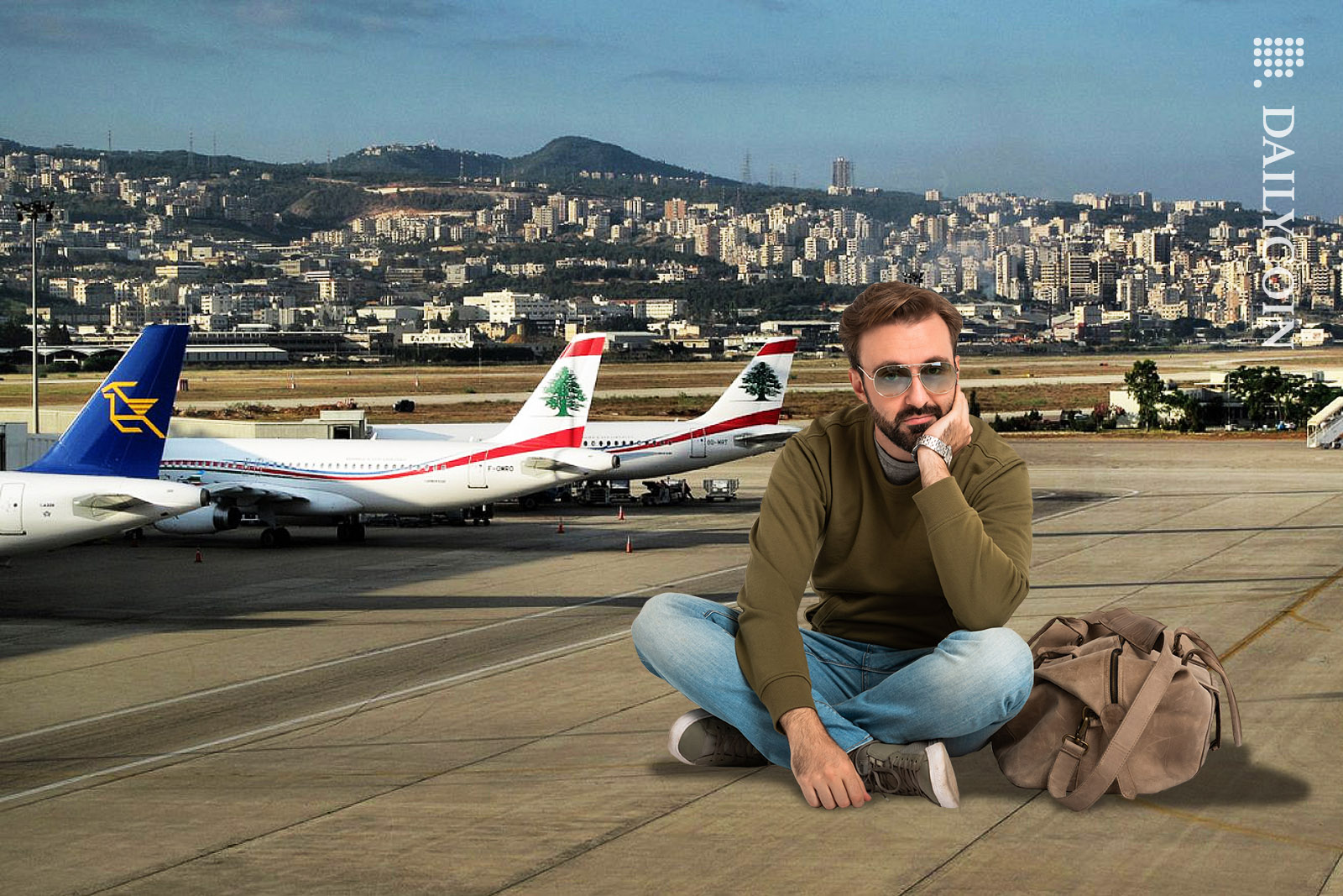 Man sitting on Beirut Airport's runway tarmac, looking very disappointed.