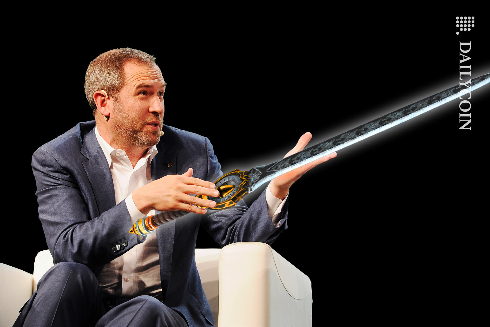 Bred Garlinghouse sitting in an armchair, presenting a sword.