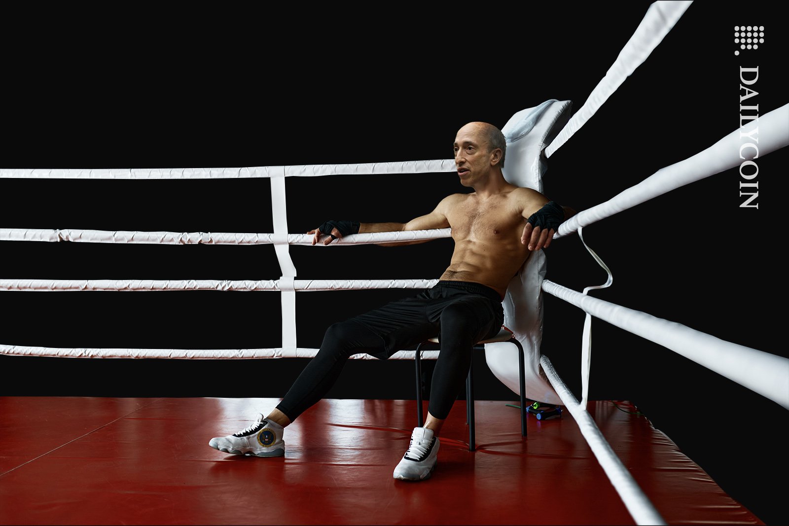 SEC's Gary Gensler sitting in the corner of a boxing ring, getting ready for the next round.