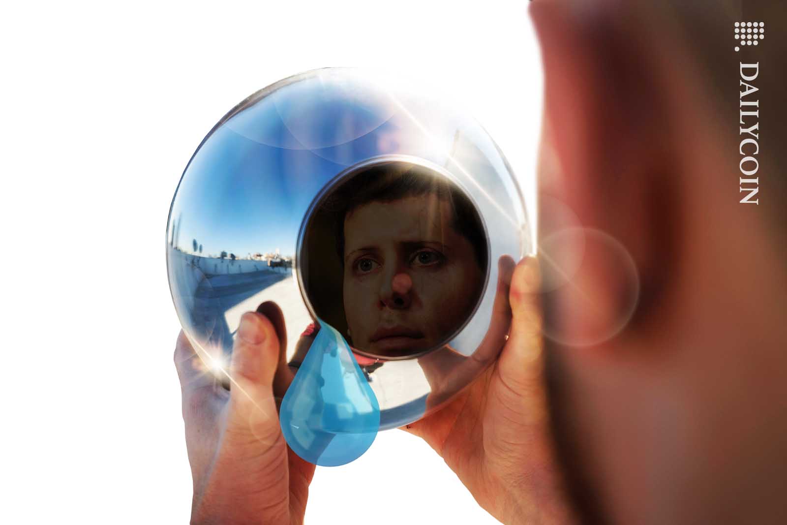 Sam Altman's face on the reflection of an World Coin eye scanner sphere. Large teardrop rolls off the scanner.