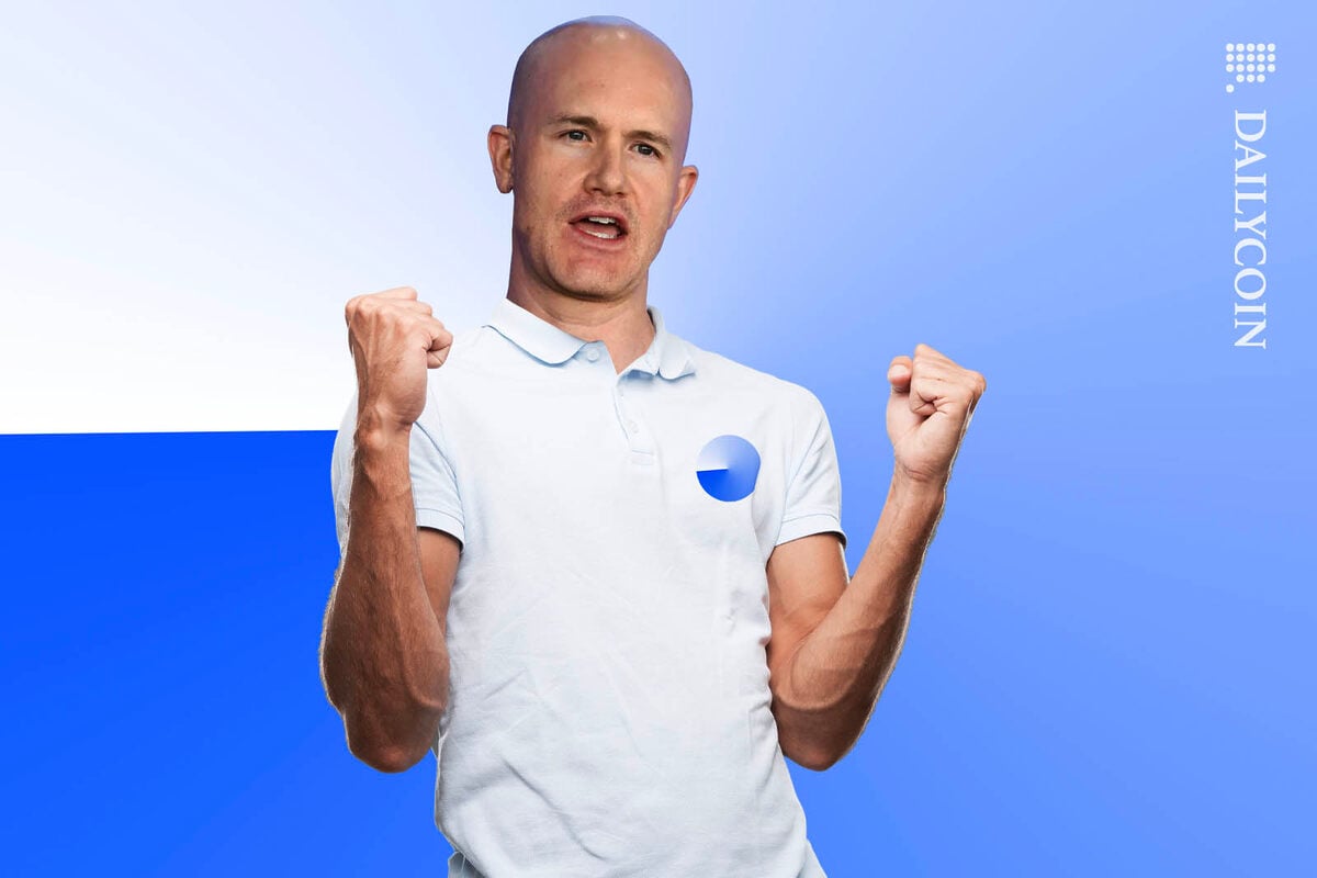 Brian Armstrong of Coinbase wearing a BASE t-shirt, celebrating a small victory.
