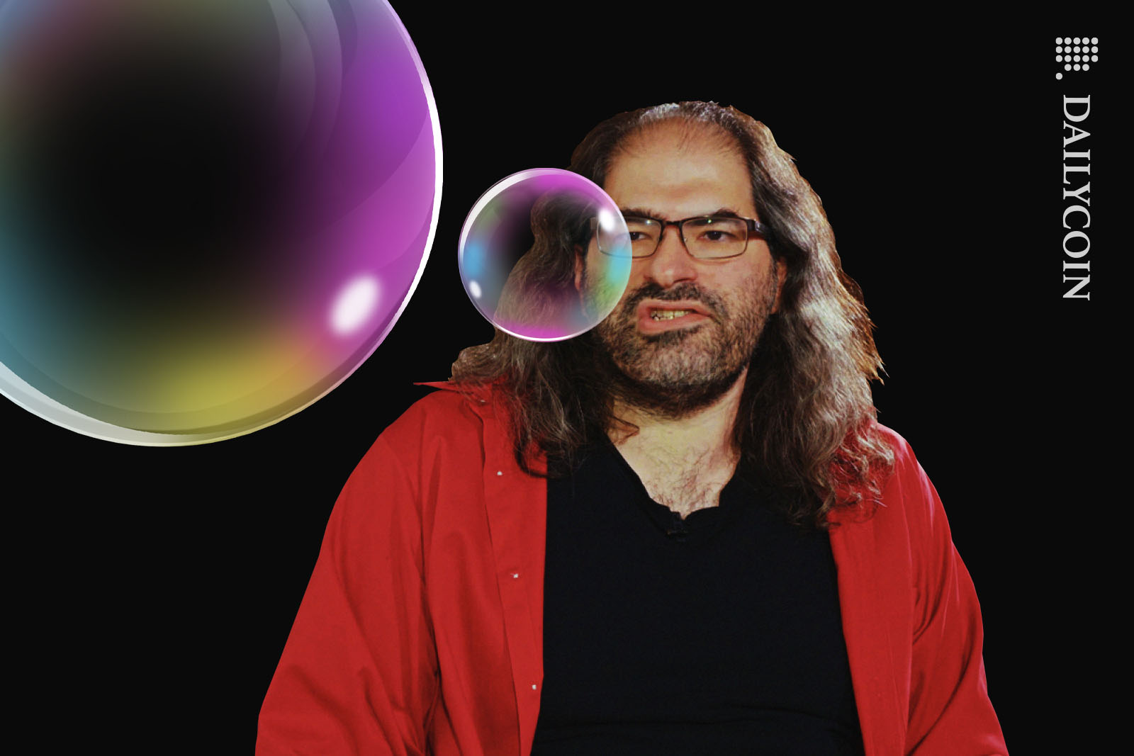 David Schwartz burping up two colourfull soap bubbles.