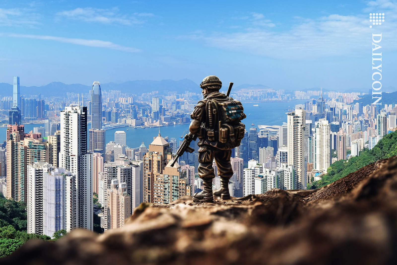 FTX toy soldier looking over Hong Kong from a viewpoint on a mountain, ready for attack.