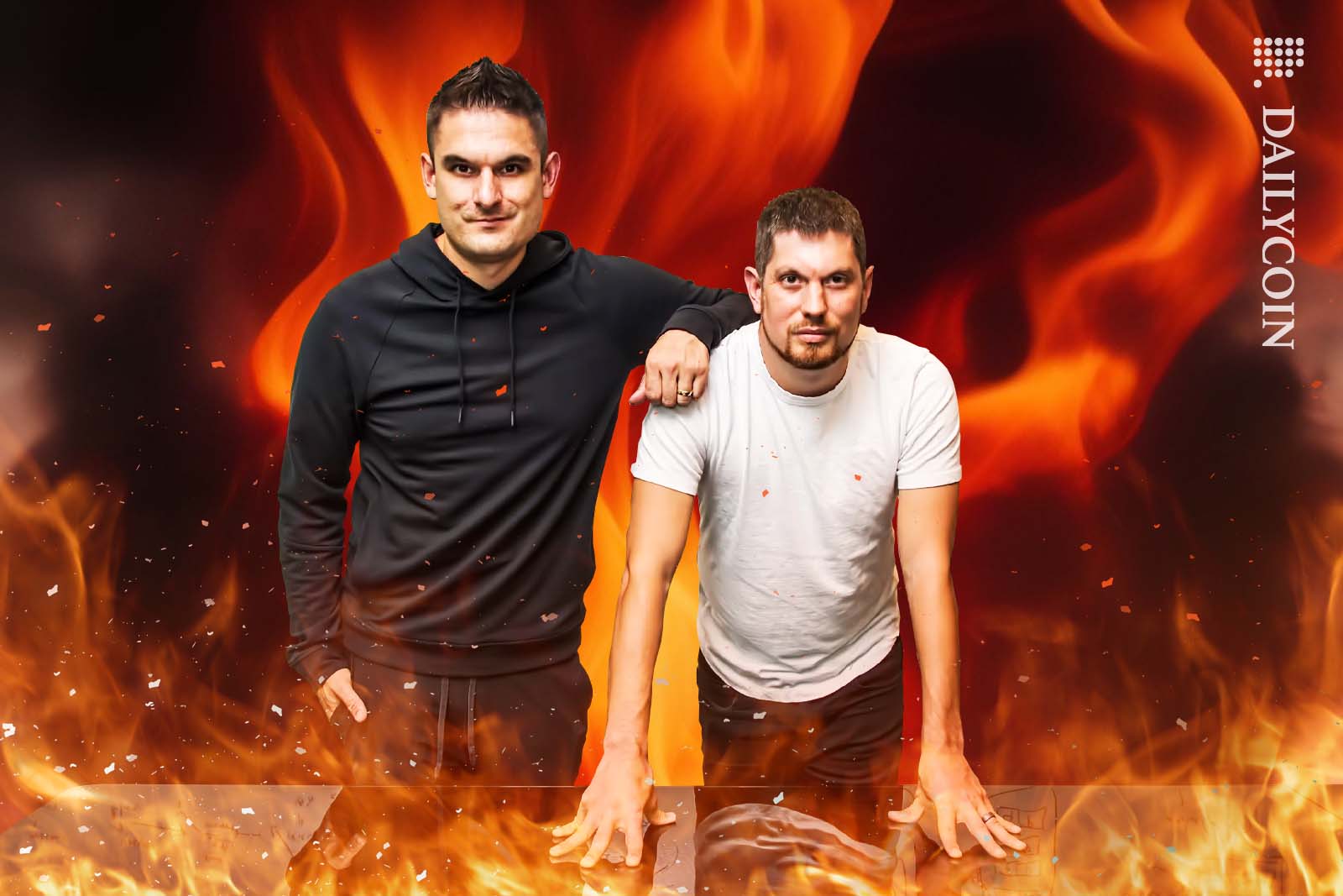 Ryan Zarick and Bryan Pellegrino have a wierd smile on, whilst staring at the camera surrounded by fire.