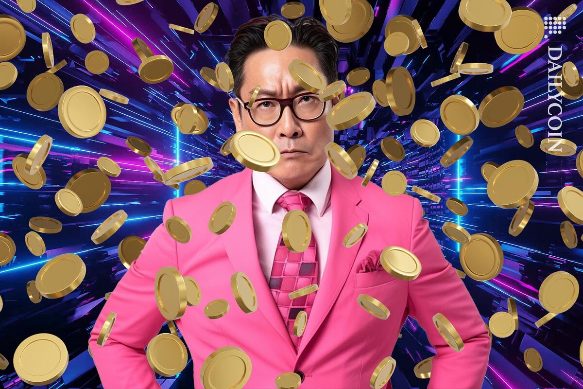 Angry asian man in a pink suit surrounded by coins.