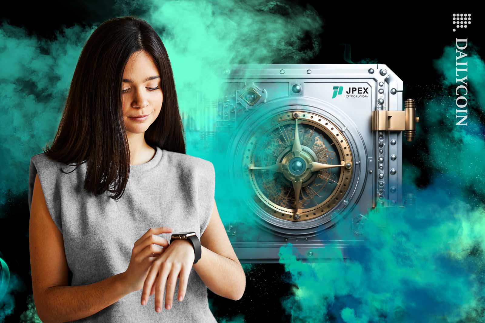 Young woman looking at her watch wandering when she can access her assets from the JPEX vault behind her.