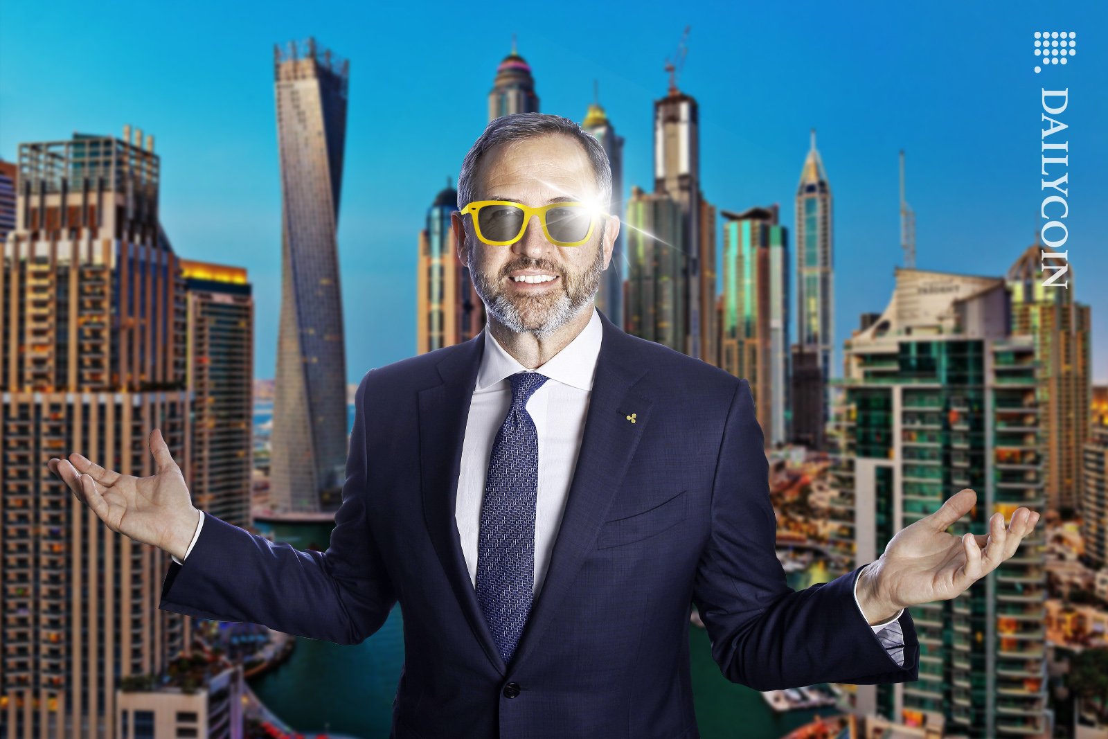 Bred Garlinghouse in Dubai wearing golden sunglasses, looking confident.