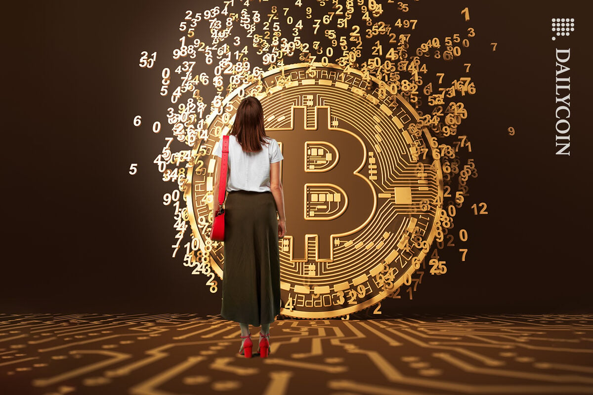 Woman watches number go in the air from Bitcoin.