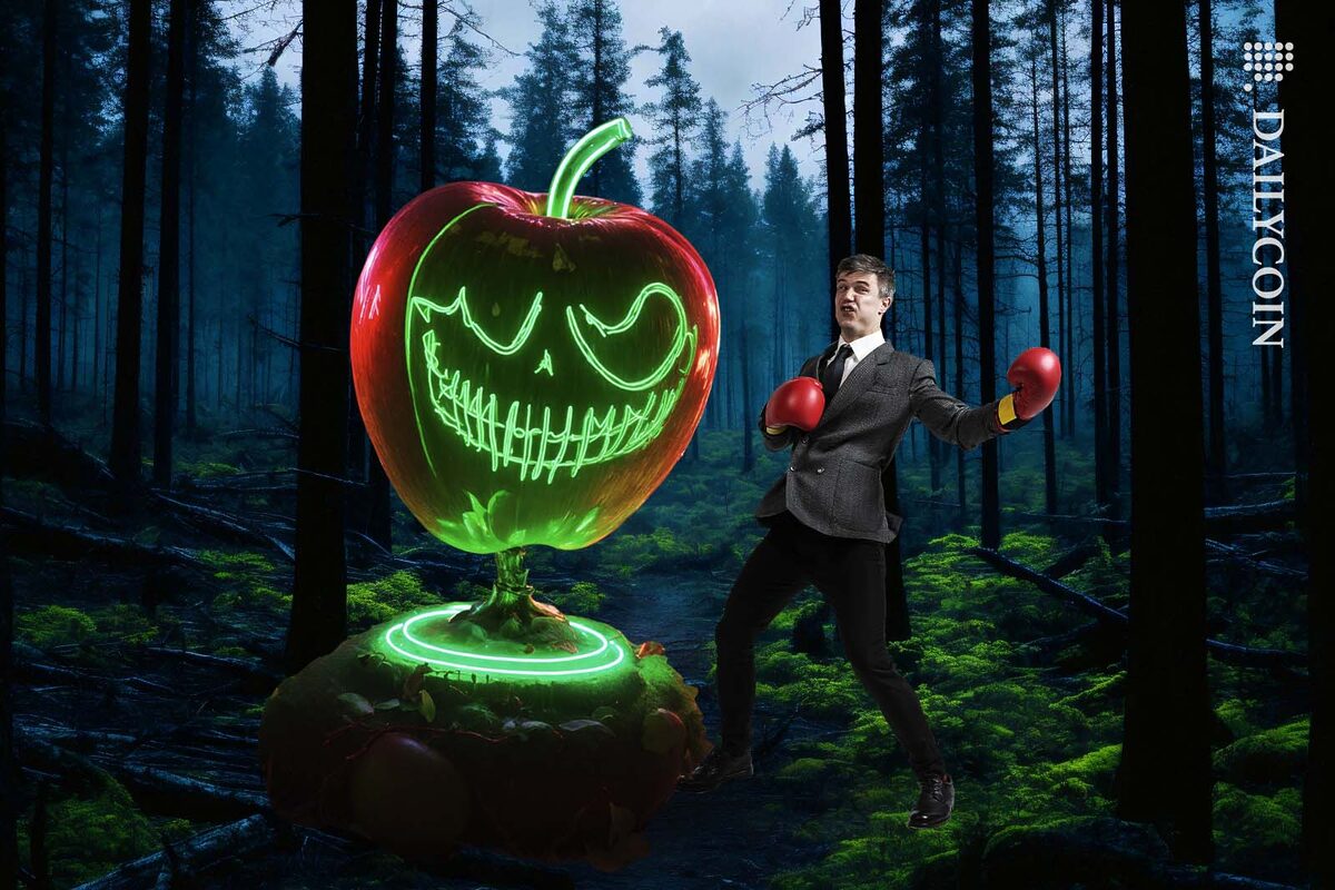 Man in suit wearing boxing gloves punching an evil apple in the forest.