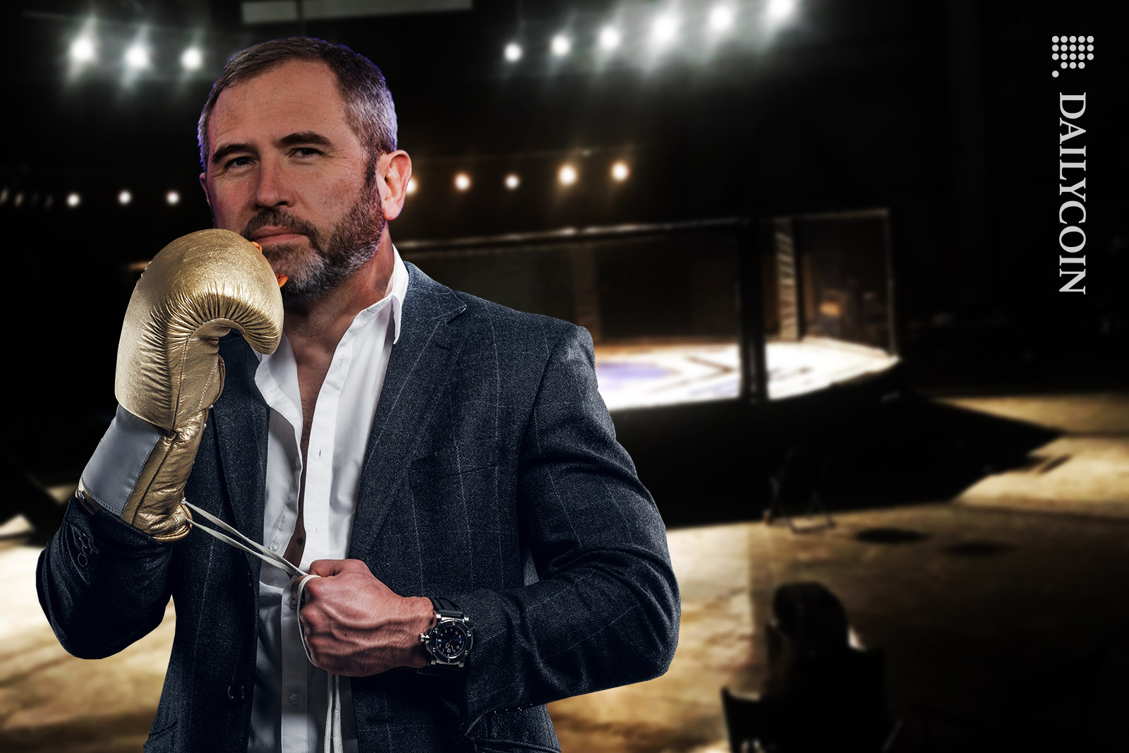 Bred Garlinghouse putting on Golden boxing gloves, ready for a fight.