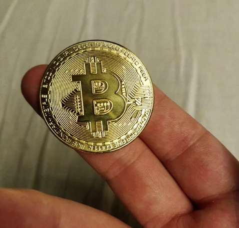 Physical Bitcoin in hand.