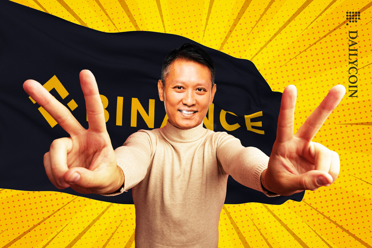 Binance CEO Richard Teng showing two peace signs smilling.