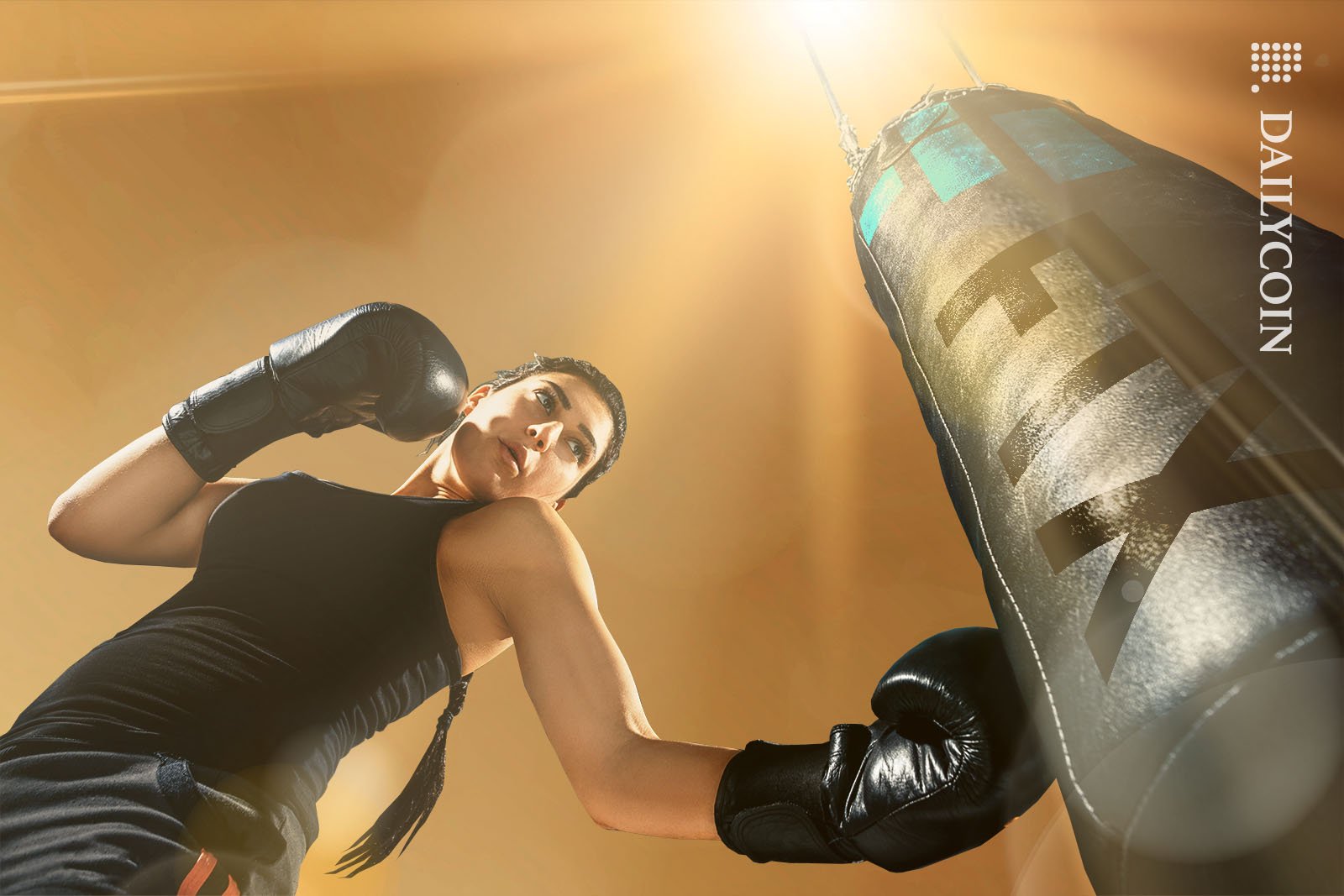 Female boxer punching FTX Punch bag.