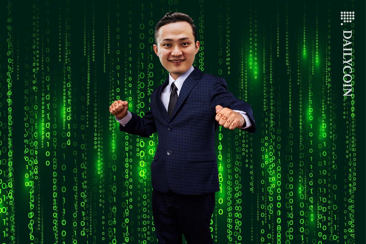 Justin Sun posing victoriously infront of a matrix style binary code digital background.