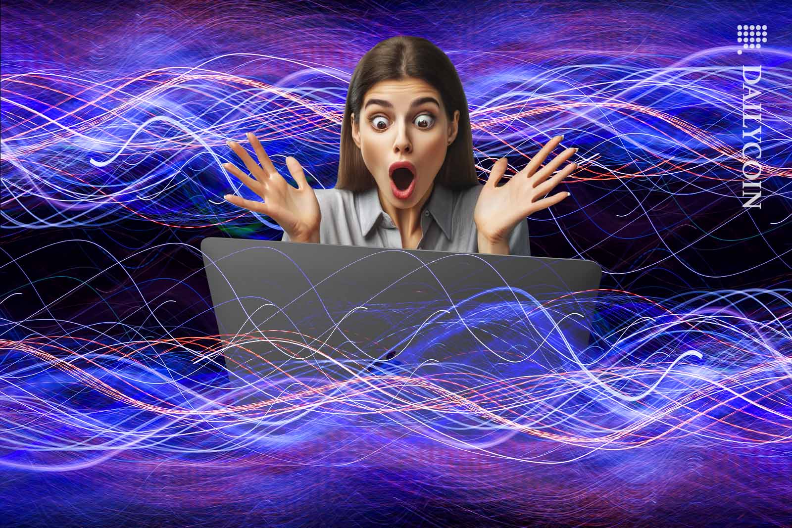 Woman looks extremly shocked about what she sees on the screen of her laptop.