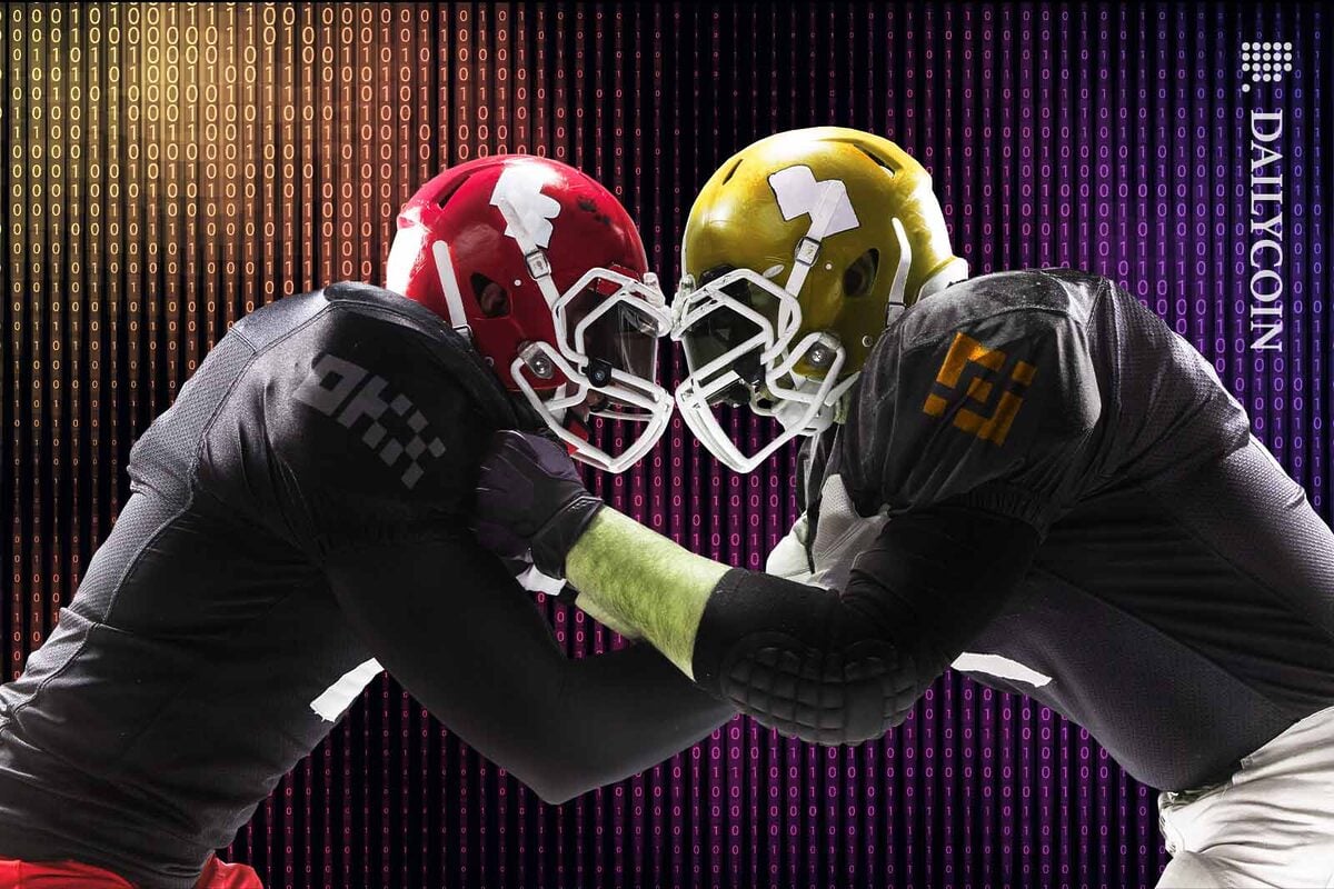 Two American football players bumping heads.