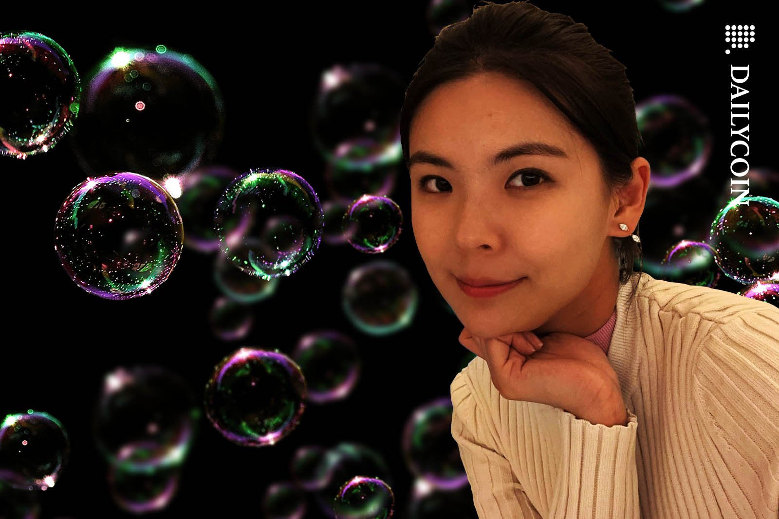 Gracy Chen with a smile, surrounded by soap bubbles.