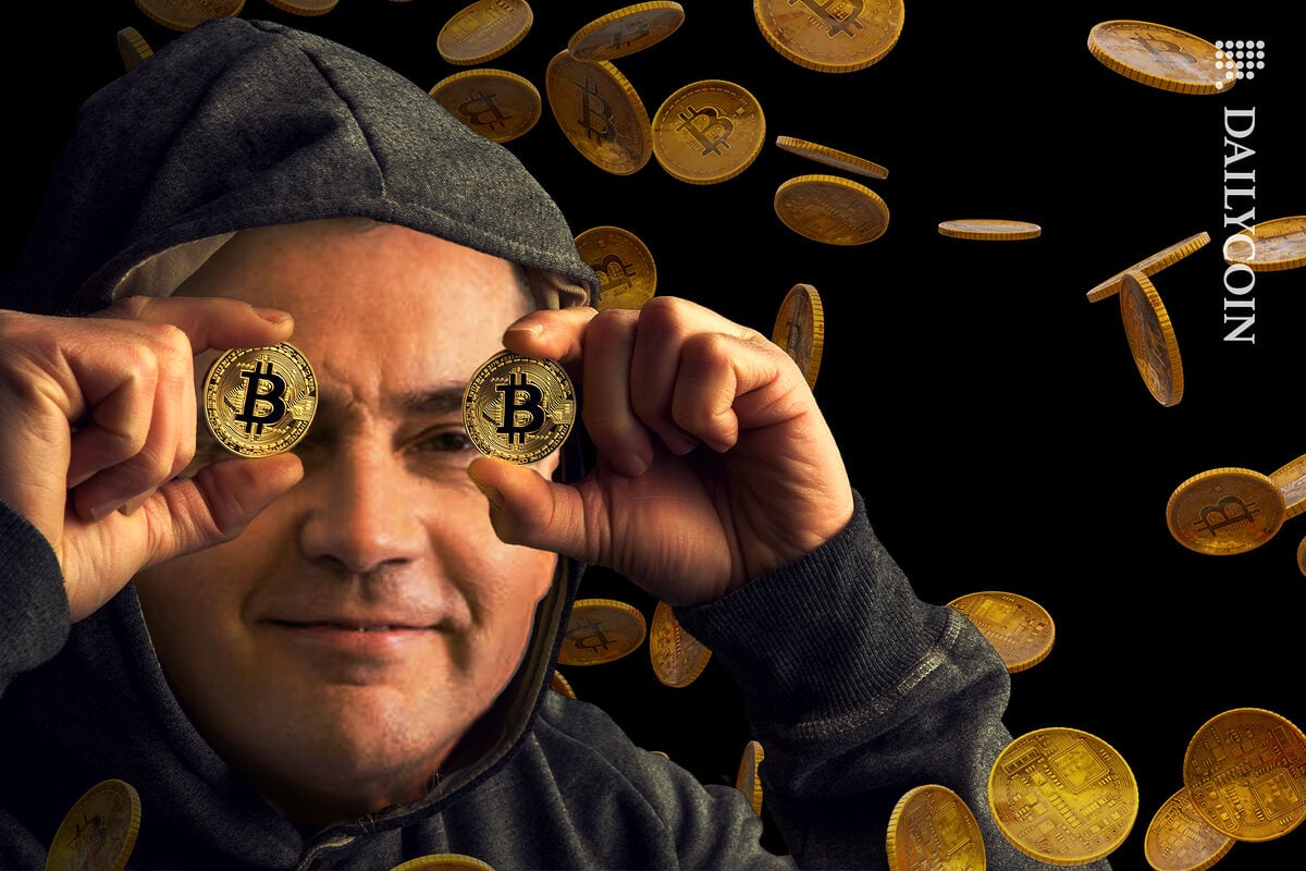 Craig Wright in a hoodie hiding behind bitcoins eyes with bitcoins falling around him.