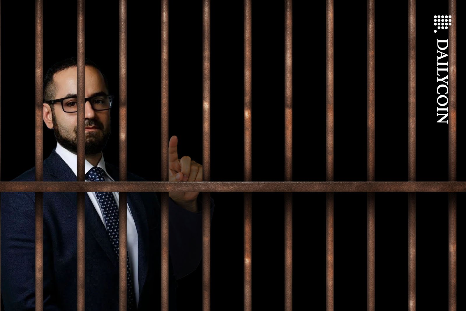 Tigran Gambaryan of Binance pointing a finger from a prison cell.