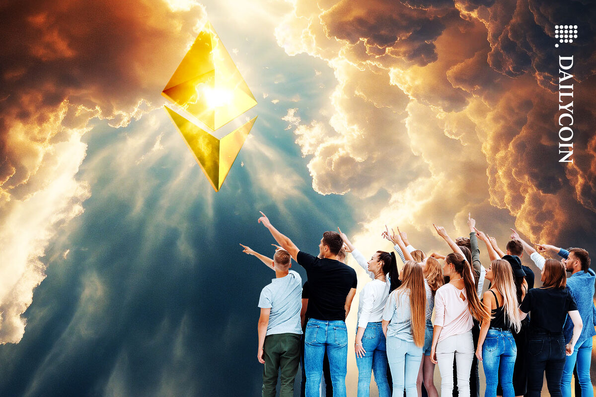 A group of people pointing at an Ethereum Logo shining on the sky.