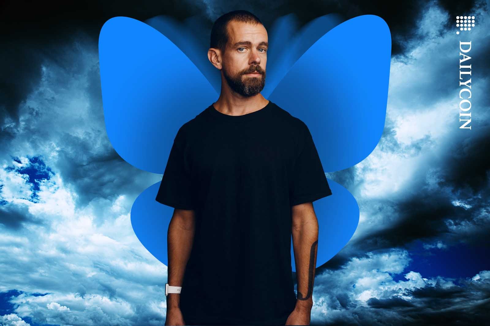 Jack Dorsey about to take off with blue butterfly wings on his back.