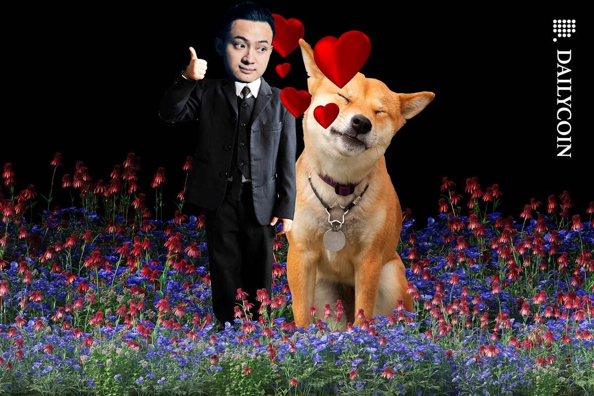 Justin Sun standing next to a Shiba Inu fully in love with it.