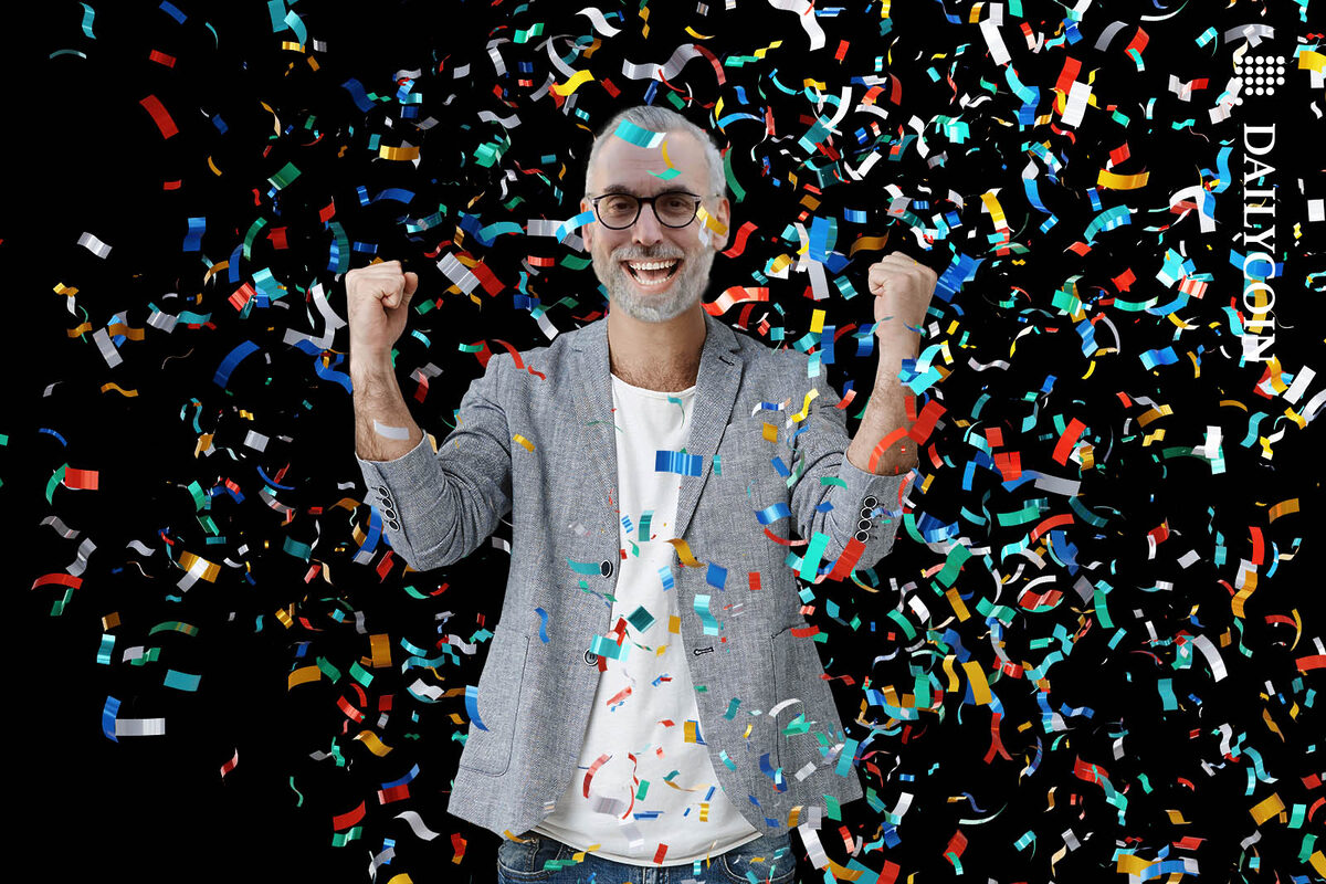 Stuart Alderoty celebrating with confetti flying all around him.