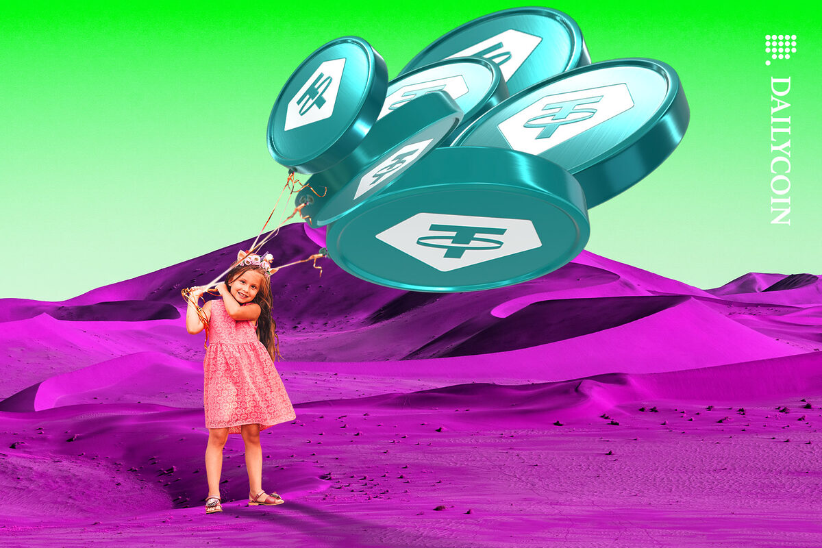 Little girl holding a bunch of Tether balloons in a purple desert.