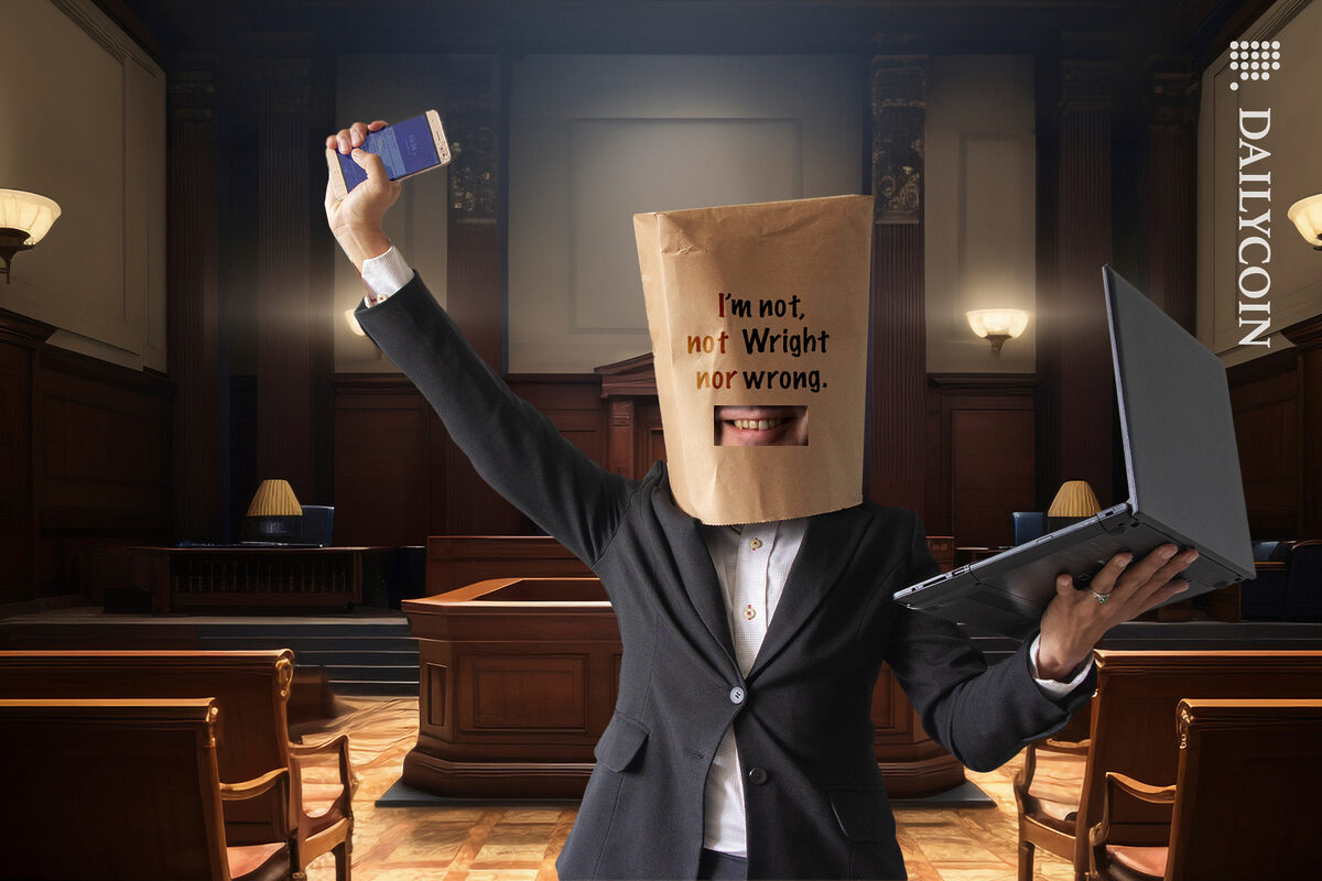 Craig Wright wearing a bag on his head in court with the message '' I'm not, not Wright, nor wrong''