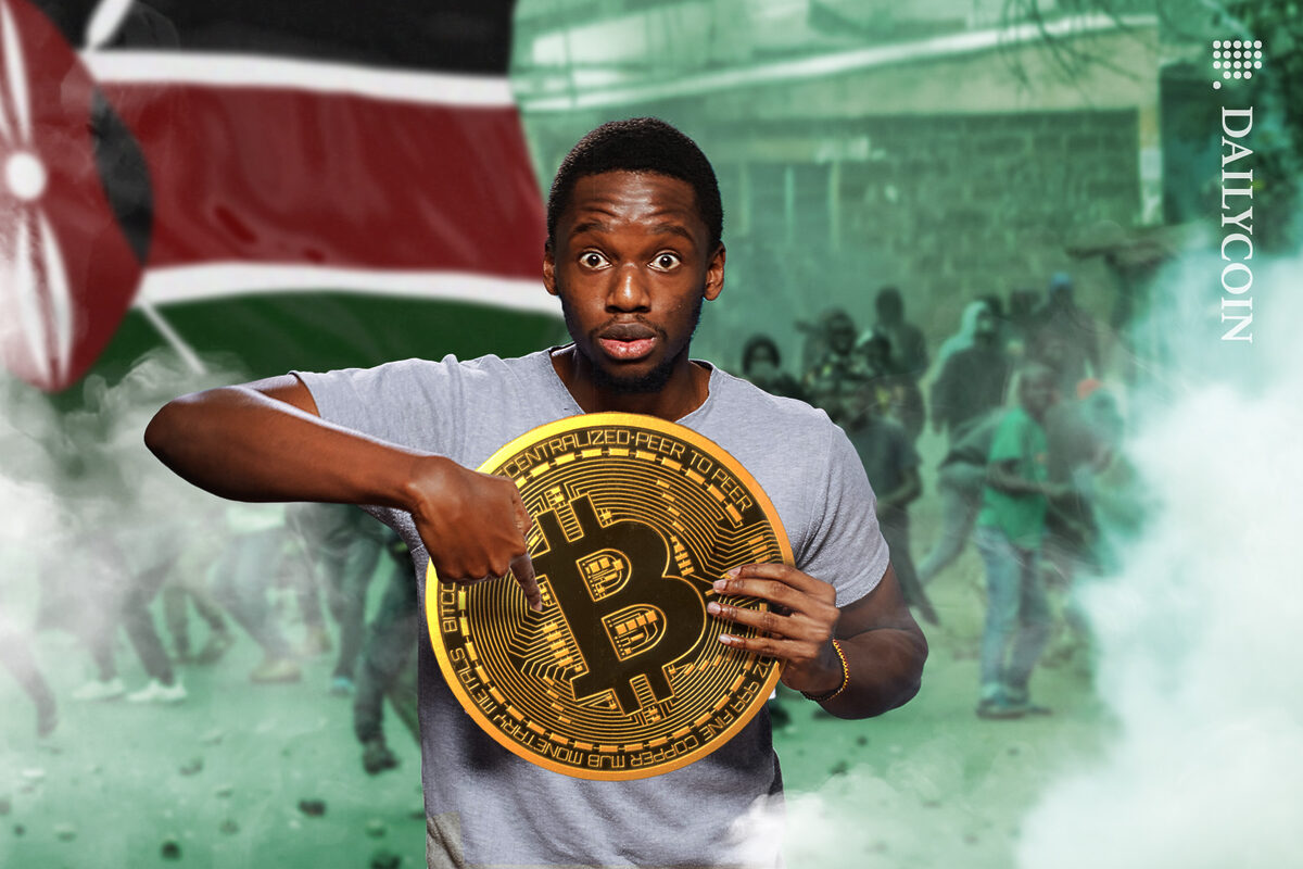 Guy worried pointing at a massive Bitcoin in Kenya whilst protest are happening.