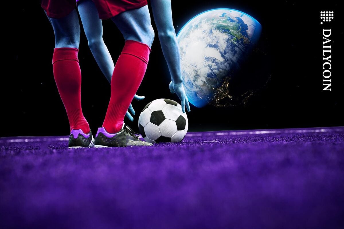 A football player getting ready to execute a free kick towards Earth.