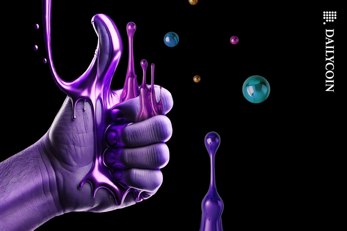 Hand showing thumbs up as colourful liquid metal dripping upwards from between its fingers.
